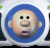 The Undo Guy from Kid Pix Deluxe. Undo Guy is basically a 3D low-resolution baby head.